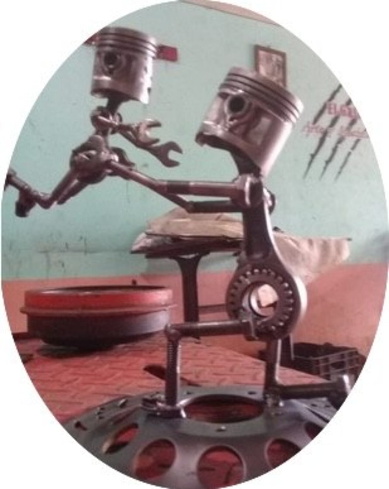 Padre e hijo robot hecho con levas, pistones y llaves.